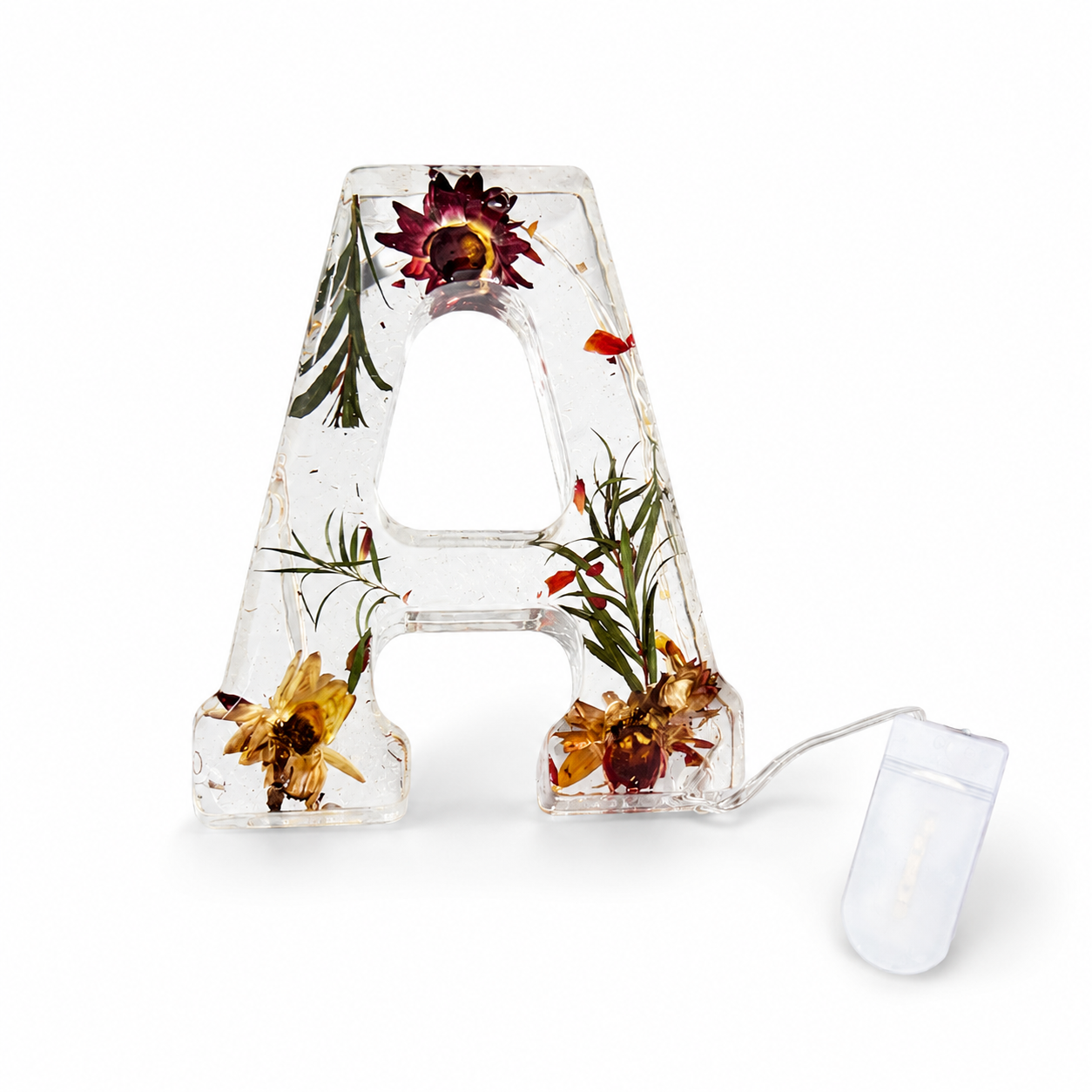 Buchstaben-Harzlampe mit getrockneten Blumen